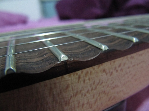 Scalloped fingerboard details